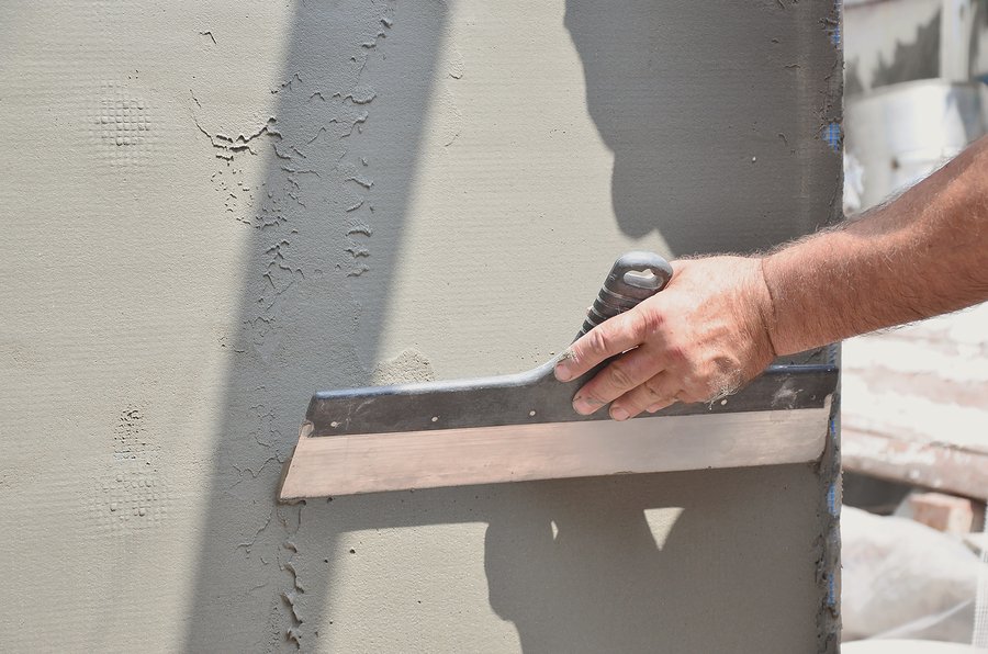 Hands Of An Old Manual Worker With Wall Plastering Tools Renovat